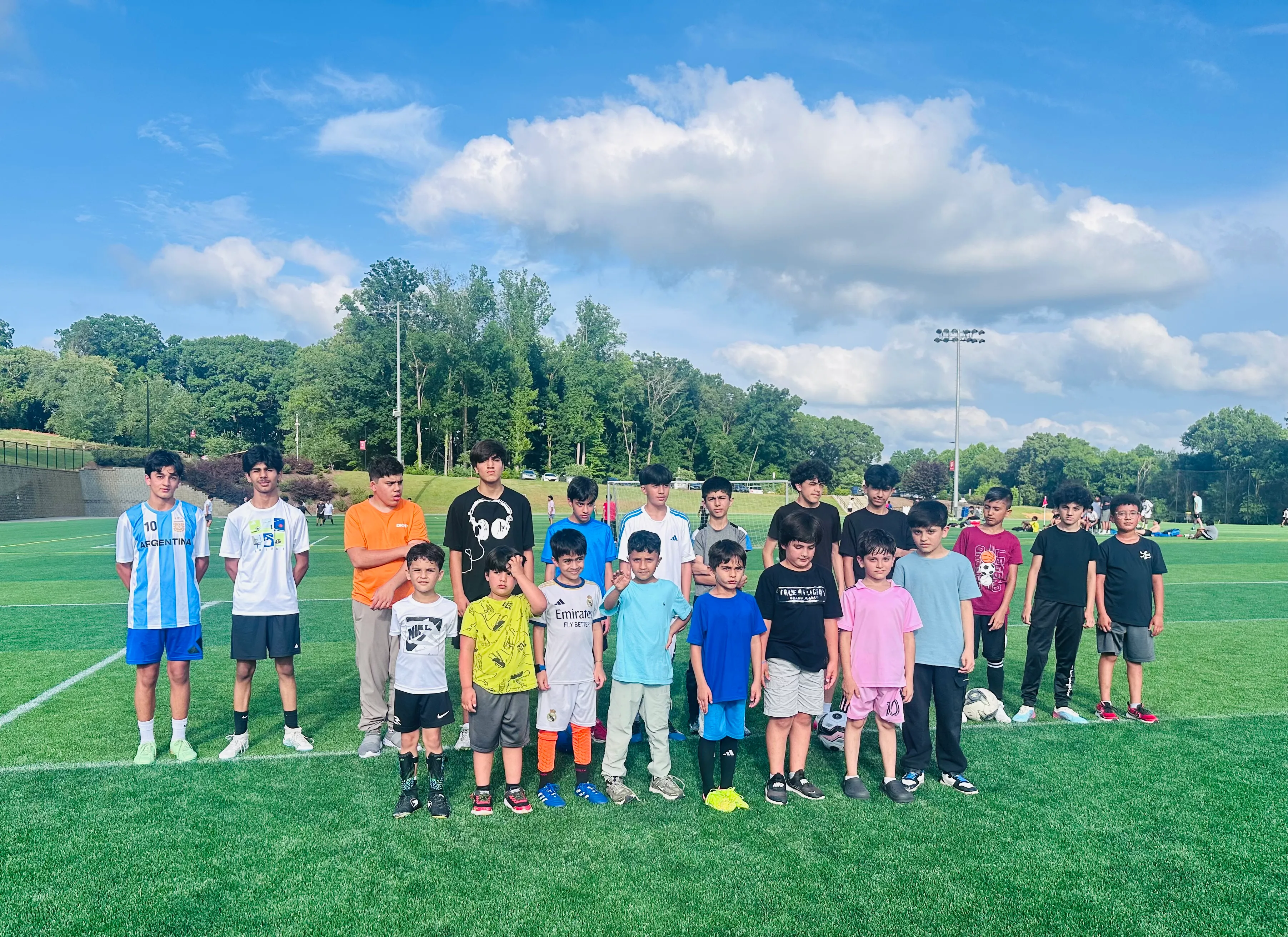 The Maihan Association youth soccer team together on the field.